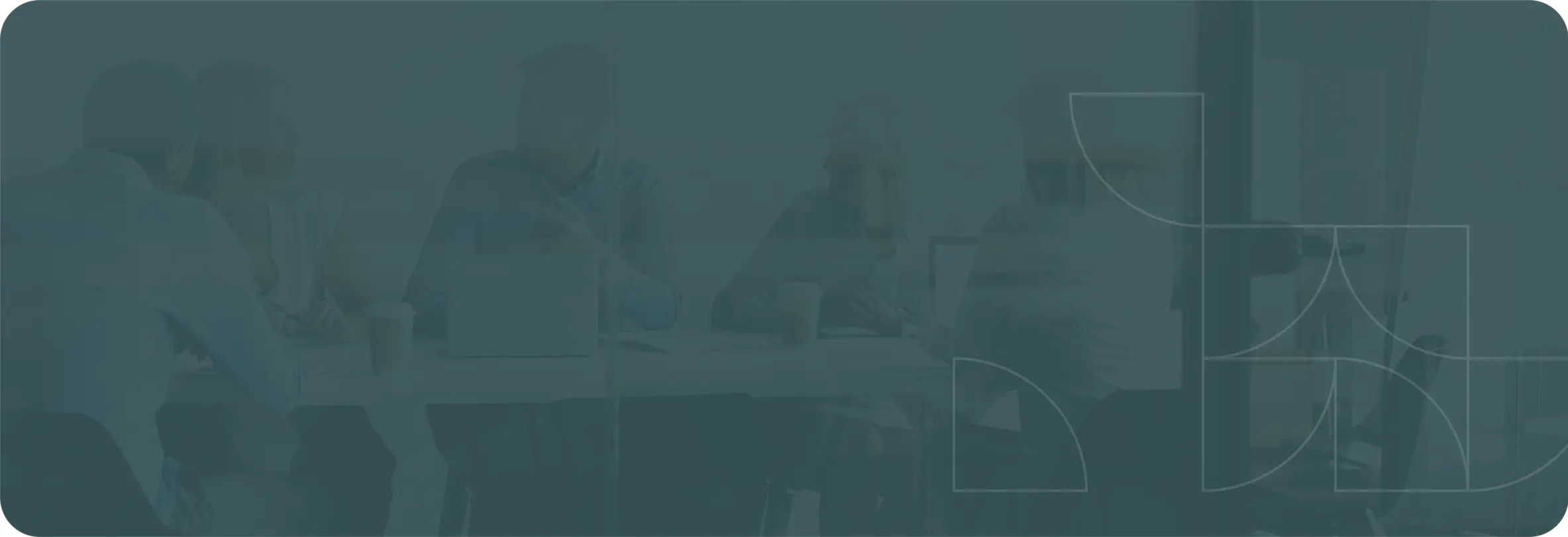 People sitting at a table talking with open laptops on table. Used as background image